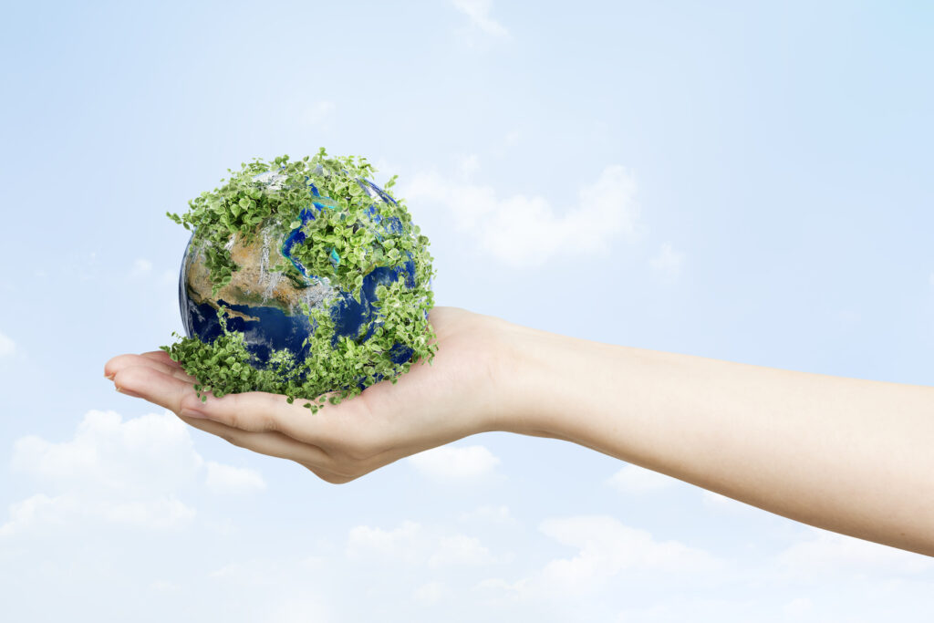 sustainable-living-environmentalist-hand-holding-green-earth-scaled